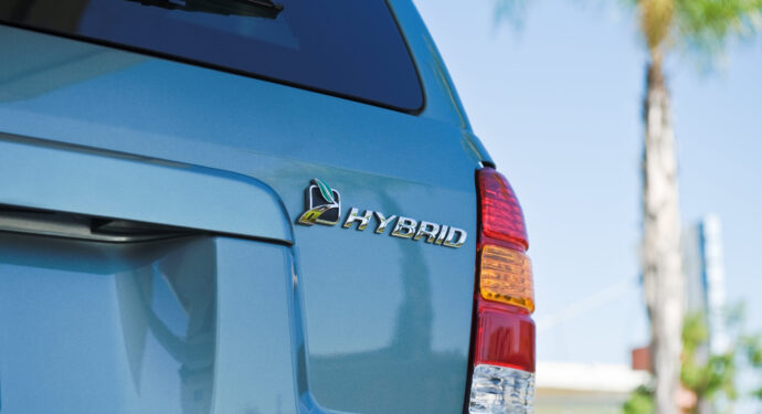 An image of a hybrid car's logo on the back of a hybrid car